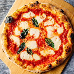 Classic Margherita pizza topped with fresh mozzarella, basil, and tomato sauce.
